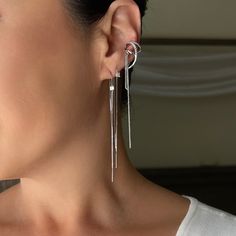 Our Ciera Ear Cuff is a single piece of earring that features a draping, looping, free falling design with different textures and a hanging chain. Get the layered ear look without the piercing! Add this cuff to your cartilage for an ear stack that's one-of-a-kind. No piercing needed! Each order comes with 1 earring Face Gems, Ear Jacket Earring, Earring Jackets, Free Falling, Gold Ear Cuff, Thread Earrings, Ear Stack, Dainty Chain, Threader Earrings