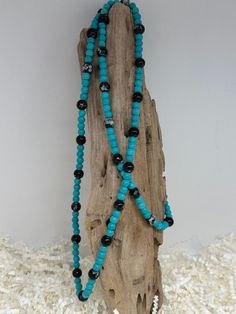 Beaded glass and Turquoise necklace. Long for layering. Adjustable Multi-strand Turquoise Beaded Necklace, Multi-strand Beaded Turquoise Jewelry, Adjustable Single Strand Turquoise Beaded Necklace, Adjustable Turquoise Single Strand Beaded Necklace, Southwestern Turquoise Jewelry For Beach, Turquoise Beaded Czech Glass Necklace, Turquoise Round Bead Jewelry For Beach, Turquoise Czech Glass Bead Jewelry, Long Turquoise Necklace With Colorful Beads