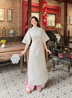 🌿 This set includes traditional Ao Dai, No pants. Style: Traditional Material: Very well made with high-quality silk Collar: traditional collar Please provide bust-waist-and hip measurements when placing your order to ensure the best fit for you. 🌿 NOTE: * Recommend gentle washing * Please contact us for any inquiries about size. We don't have an exchange policy for the wrong size * It is safe for a washer and dryer in a "delicate" setting. * Actual Ao Dai colors may differ up to 10% due to lightning and viewing devices. * These ao dai pants are made based on Vietnamese size; they will run smaller than American size. *3D printed ao dai: you may see some white broken fabric around the seam (collar). *There might be some chalk/ pen writings on the fabric because it is brand new, unwashed a Traditional White Short Sleeve Ao Dai, Traditional White Ao Dai With Short Sleeves, Traditional White Ao Dai With Floral Embroidery, Traditional White Cheongsam With Stand Collar, Traditional Embroidered Short Sleeve Ao Dai, Traditional White Cheongsam For Spring, Festive Traditional Cheongsam With Short Sleeves, Traditional Short Sleeve Sets For Spring, Festive Traditional Short Sleeve Cheongsam