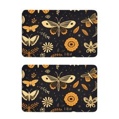 two placemats with butterflies and flowers on them, one is black and the other is orange