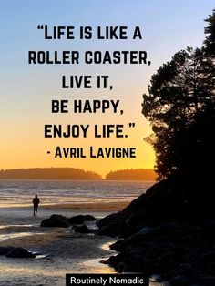 a person standing on top of a beach next to the ocean with a quote about life is like a roller coaster, live it, be happy, enjoy life - avril lavie