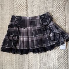 Cute Plaid Pleated Skirt. Zipper Side W/ Corsette Bows & Lace Edge. 14in Waist, 13in Length. Size M (Juniors) Nwt Plad Skirts, Tvd Style, Grunge Skirts, Layered Pleated Skirt, School Skirts, Riot Grrl, Skirts Plaid, Y2k Inspo, Black Plaid Skirt