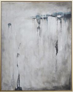 an abstract painting with white and grey colors on the wall, including one large piece of artwork