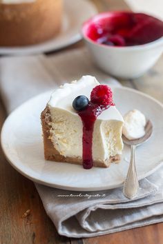 a piece of cheesecake with berries on top