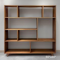 a wooden shelf with several shelves on each side and one section missing from the wall