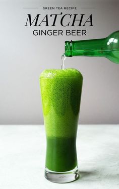 a green drink being poured into a glass with the caption matcha ginger beer