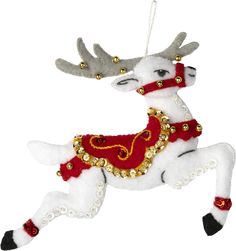 a white and red reindeer ornament hanging from a string