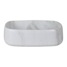 a white marble bowl sitting on top of a table