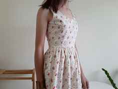 "Cream Floral Print Dress - Cotton fabric - Invisible nylon zipper on the back - Fixed waist - Fully lined - Ready to ship in 1-3 business days Measurements : Bust : 34\" Waist : 26\" Hips : free Total length : 36.5\" Shoulder to waist : 14.5\" Model height : 5'6\" bust : 33\" waist : 25\" hips : 35\" Please read the policies tab before purchase. I can't have a model for clothes of all sizes, but I have already clearly written a model size. If you have questions about the size, picture, or other Cream Floral Dress, Cotton Dress Fabric, Women Cotton Dress, Sundress Summer, Dress Open Back, Pin Up Dresses, Open Back Dress, Scoop Neck Dress, Dress Pin