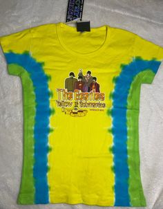 Vintage Liquid Blue Beatles Yellow Submarine tie dye t shirt with print on front. Baby doll style, Size SMALL. Collectible! New/old store inventory. Never worn, not preowned. Vintage but new and never worn! Retro Tie Dye T-shirt With Graphic Print, Fun Tie Dye Top With Graphic Print, Green Band Merch Tops For Summer, Multicolor Band Merch Tops For Summer, Fun Tie-dye Pre-shrunk Top, Fun Tie Dye Pre-shrunk Top, Fitted Acid Wash T-shirt With Graphic Print, Hand Dyed Blue Graphic Tee, Fun Pre-shrunk Tie Dye Top