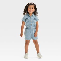 This Solid Romper from Cat & Jack™ in light blue denim made from 100% cotton material makes a comfy one-piece outfit in your little one's wardrobe. Designed with short sleeves, it sports a classic collared neckline with front buttons, side and chest patch pockets for functional style, and an elastic waistband for a snug fit. Cat & Jack™: Designed for all children so you can trust it's made for yours. Cotton Denim Jumpsuit With Short Sleeves, Relaxed Fit Cotton Denim Jumpsuit, Relaxed Fit Cotton Denim Jumpsuit With Short Sleeves, Casual Short Sleeve Relaxed Fit Denim Jumpsuit, Casual Short Sleeve Denim Jumpsuit With Relaxed Fit, Casual Denim Jumpsuit With Short Sleeves, Casual Denim Jumpsuit With Short Sleeves And Relaxed Fit, Short Sleeve Cotton Denim Jumpsuit With Pockets, Blue Denim Short Sleeve Jumpsuit