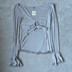 Free People Intimately Freeknit Shimmer Bell Sleeve Tie Front Shirt Size Small New With Tags Top Is Gray *Green And Blue Pictured Tops Are Just Examples* Fitted V-neck Sweater For Loungewear, Feminine Fitted Tops For Loungewear, Feminine Stretch Long Sleeve Top, Feminine Long Sleeve Stretch Top, Fitted V-neck Loungewear Sweater, Fitted V-neck Knit Top For Loungewear, Fitted V-neck Tops For Loungewear, Fitted Tops For Fall Loungewear, Spring Knit Top For Loungewear