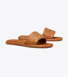 Double T Sport Slide: Women's Designer Sandals | Tory Burch Sleek Leather Slip-on Slides, Classic Leather Slides, Classic Slides With Calf Leather Footbed, Classic Leather Slides With Stitched Sole, Classic Calf Leather Slides With Leather Lining, Classic Slides With Cushioned Footbed, Miller Sandal, Woven Sandals, Tory Burch Sandals