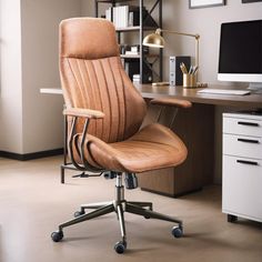 an office chair sitting in front of a computer desk