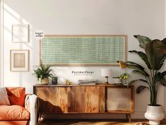 a living room filled with furniture and potted plants on top of a wooden cabinet