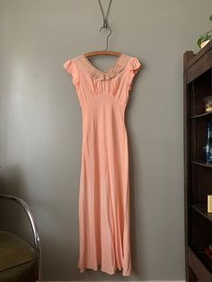 "1940s Pandora Peach Silk Nightgown in overall excellent condition with just one very faint spot (hardly noticeable, please see last photo). Measured flat: Pit to pit 16\" Waist 12.5\" - stretches to 14.5\" Hips 19\" - stretches to 20.5\" Length 53\" PLEASE READ! *MEASUREMENTS* All items are measured while laying flat and unstretched. For clothing: chest, waist, hip and thigh measurements should be multiplied by two. All measurements are in inches. *VINTAGE CONDITION* Vintage goods may show sign Fitted Vintage V-neck Nightgown, Vintage Fitted Nightgown For Sleep, Night Slip, Nightgown Vintage, 1920 Dress, Sleeping Dress, Silk Nightgown, Pink Gowns, Women's Nightgowns