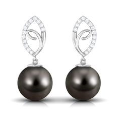 Product Details The stunning Leaf Drop Earrings are embellished with Round Shape Tahitian Pearl hanging as a drop while sparkling three Round Diamonds enhance the charm of the leaf design. Your look isnt complete without this captivating pair of Black Pearl Earrings that secure comfortably with a latch back closure. No need to look for occasions to style this pair, flaunt the Tahitian Earrings with any attire to get an elegant charm. Product Information SKU SHP-EARRINGS052310041 Weight 2.32 gm (Approximate) TAHITIAN PEARL INFORMATION No.of Stones 2 Pieces Total Weight 15.00 Carat (Approximate) Dimension(approx) Round-10X10 mm-2 Pcs Color Black Cut Brilliant Shape Round Setting Type Bead-Set Quality Grade AAA DIAMOND INFORMATION No.of Stones 26 Pieces Total Weight 0.32 Carat (Approximate) D Black Pearl Earrings, The Leaf, Tahitian Pearls, Black Pearl, Leaf Design, Round Shape, Round Diamonds, To Look, Pearl Earrings