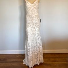 Nwt Lulas Women’s Flynn Ivory Lined Lace Maxi Dress With Train. Size Small Slip Into The Lulus Flynn Ivory Lace Maxi Dress! Stunning Floral, Eyelash Lace Tops A Beige Liner As It Shapes A V-Neck And Princess-Seamed Bodice. Full Maxi Skirt Has A Concave Mermaid Hem And A Romantic Lace Train. The Lace On This Dress Is A Ivory Almost White Color (See Picture) Hidden Back Zipper/Hook Clasp. Dress Measures 12.5" Longer At Back. Lined. Shell: 60% Cotton, 40% Nylon. Contrast: 100% Polyester. Lining: 10 Cream Lace Maxi Dress With Lace Trim, Beige Lace Floor-length Maxi Dress, Off-white Maxi Dress With Lace Trim For Vacation, White Lace Maternity Maxi Dress, Maternity Lace Maxi Dress With V-neck, Full Maxi Skirt, Romantic Lace, Lace Maxi, Lulu Dresses