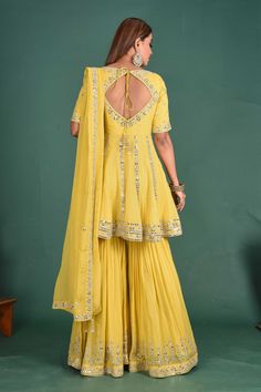 Beautiful yellow embroidered peplum sharara suit with dupatta. It is perfect for weddings and special occasions. Shop online from Pure Elegance. Peplum Sharara Suit, Peplum Sharara, Indian Designer Dresses, Suit With Dupatta, Sharara Suits, Wedding Lehengas, Designer Lehengas, Suits Wedding, Sharara Suit