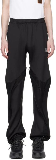 Olly Shinder.SSENSE Exclusive Black Tri-Zip Sweatpants.Polyester jersey sweatpants..· Concealed drawstring at elasticized waistband.· Two-pocket styling.· Logo printed at front.· Zip mesh expansion panel at legs.· Elasticized cuffs.Available exclusively at SSENSE..Supplier color: Black.Body: 100% polyester. Trim: 100% polyester..Made in United Kingdom..241077M190000 Sporty Streetwear Pants With Zipper Closure, Sporty Nylon Bottoms With Zipper Closure, Athleisure Sports Bottoms With Zipper Closure, Stretch Sports Bottoms With Zipper Closure, Sports Pants With Zip Fly In Black, Black Sporty Pants With Zip Fly, Sporty Pants With Zip Fly For Sports, Sporty Black Pants With Zip Fly, Sporty Black Bottoms With Zipper Closure