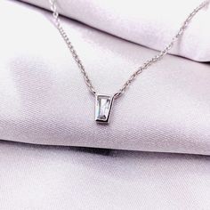 This beautiful white gold necklace features a dainty CZ solitaire on a delicate chain. The perfect accessory for any occasion, this timeless piece is sure to be a favorite for years to come. We hope you enjoy it as much as we do! Available in Gold and Silver Our gold-plated brass jewelry is plated at twice the thickness of standard gold plating.  Then a layer of e-coating is applied to make it last even longer for everyday wear. DETAILS: 14k white gold-plated  or gold-plated brass Length: 16 inc Dainty White Gold Solitaire Necklace, White Solitaire Necklace With Clavicle Chain For Anniversary, Dainty White Solitaire Necklace For Formal Occasions, Formal Silver Solitaire Necklace With Delicate Chain, White Diamond Necklace With Vs Clarity As A Gift, Silver Solitaire Necklace With Delicate Chain For Anniversary, Delicate Silver Solitaire Necklace For Formal Occasions, White Gold Solitaire Necklace With Delicate Chain, Dainty Silver Solitaire Necklace With Brilliant Cut