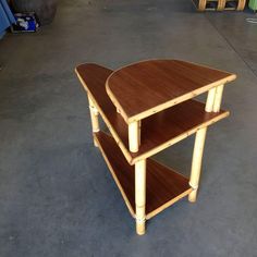 two wooden tables stacked on top of each other