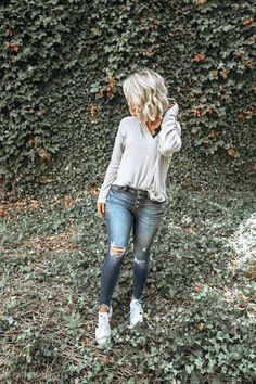 Distressed jeans Mid-rise Distressed Bottoms For Fall, Light Wash Grunge Jeans For Fall, Casual Distressed Bottoms For Fall, Trendy Soft-washed Jeans For Fall, Distressed Mid-rise Jeans For Fall, Mid-rise Distressed Jeans For Fall, Mid-rise Grunge Jeans For Fall, Grunge Mid-rise Jeans For Fall, Edgy Medium Wash Jeans For Fall