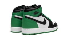 The Air Jordan 1 High GS “Lucky Green” is the youth sizing of the colorway of the vintage basketball and lifestyle shoe that is inspired by the popular “Celtics” style from 2009’s “Defining Moments Pack. ” Although not a one-to-one remake of the Air Jordan 1’s “Celtics” colorway from the aforementioned collection, the “Lucky Green” is nonetheless similar to the design.  The shoe features a white leather base with contrasting black leather overlays on the toe cap, forefoot, and eyelets.  Lucky-Gr Logo Wings, Green Jordans, Popular Sneakers, Lucky Green, Wings Logo, Jordan 1 High Og, Stadium Goods, Kids Jordans, Air Jordan 1 High