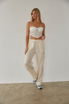 Get ready for a weekend getaway in the Vienna Linen Cargo Pants! These wide leg pants feature double front pockets, two cargo-style leg pockets, and an elastic waistband with an adjustable drawstring. Available in white and linen. Pair with the Mae Lace Crop Top to complete the look! Details 55% Linen, 45% Viscose High rise Dry clean only Linen Cargo Pants, American Threads, Get Ready For Summer, Cargo Style, Lace Crop Tops, Ruffled Maxi Dress, Sweater Sale, Lace Ruffle, Weekend Getaway