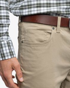 The trim fit and rigid waistband of these 5-pocket pants offers a sleek and secure fit you'll want to take on both your tailgating adventures and your dockside dinners. Crafted from a flexible fabric blend of cotton, modal, and spandex, they provide freedom of movement for anything from a walk-heavy errand to the opportunity to impress friends and family. Style: 10335 Khaki Pants Men, Trim Fit, Sophisticated Dress, Cute Swimsuits, Twill Pants, Comfy Sweaters, Khaki Shorts, Pants Men, Pocket Bag