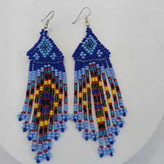 Handmade Handmade Earrings For Women Of Handmade Amazonian Jungle Beads Made With Beads Also Called Beads, Mostacillas Or Beads Are Used In Multiple Shapes, Materials, Colors And Designs Making Necklaces, Bracelets Or Other Objects For Decoration Or Personal Adornment. These Earrings Are Handmade By Peruvian Artisans In The Amazon Jungle Traditional Blue Jewelry For Beach, Traditional Blue Beach Jewelry, Bohemian Blue Beaded Earrings With Tiny Beads, Traditional Blue Beaded Earrings, Blue Beaded Earrings With Colorful Beads As Gift, Handmade Blue Beaded Earrings For Beach, Blue Large Beads Drop Earrings, Blue Large Beads Dangle Necklace, Blue Beaded Drop Earrings With Large Beads