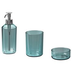 three pieces of bathroom accessories including soap dispenser and glass