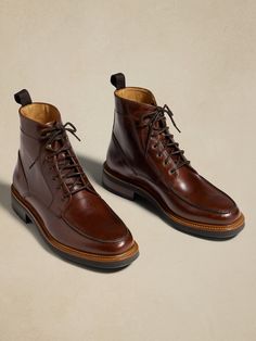 Our take on rugged luxury, this leather lace-up boot borrows its toe box construction from traditional moccasins, while quick-lace hooks at the top make for easy on-off.  Best of all, we selected a beautiful leather quality from Spain for its rich, pecan brown color.  Leather uppers and lining.  Leather, EVA, and rubber soles.  Foam footbed for comfort.  Made in Portugal.  Whole and half sizes. Brown Moc Toe Lace-up Boots With Leather Footbed, Oiled Leather Moc Toe Moto Boots For Fall, Oiled Leather Moto Boots With Moc Toe For Fall, Fall Oiled Leather Moto Boots With Moc Toe, Classic Brown Lace-up Boots With Goodyear Welt, Brown Moc Toe Lace-up Boots For Business, Classic Brown Goodyear Welted Lace-up Boots, Fall Oiled Leather Ankle Chukka Boots, Fall Oiled Leather Chukka Ankle Boots