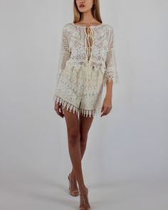 Introducing the exquisite Delicata Top, a captivating blend of French cotton lace. This cropped lace masterpiece features ¾ Kimono sleeves adorned with a lace collage and intricate trims, ensuring a touch of elegance with every wear. Available in White, Black, and Ivory, the Delicata Top is effortlessly secured with silk spaghetti ties at the center front. 100% French Cotton Lace ¾ Kimono sleeves with lace collage and trims Silk spaghetti ties at center front Dry clean only Each piece is made to White Cropped Lace Top With Lace Trim, Elegant Lace Top With Crochet Trim, Cropped Lace Top With Crochet Details, White Cropped Lace Top, Bohemian Crochet Lace For Spring, Spring Bohemian Crochet Lace, Spring Cotton Lace With Lace Work, Bohemian Lace Patchwork For Spring, Spring Cotton Crochet Lace