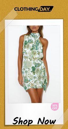 Eyes On Paradise Floral High Neck Wrap Tie Mini Dress Feminine Green Floral Print Mini Dress, Elegant Tropical Print Summer Dress, Elegant Summer Dress With Tropical Print, Elegant Green Mini Dress For Vacation, Green Sleeveless Tropical Print Mini Dress, Tropical Print Mini Length Party Dresses, Tropical Print Mini Dresses For Party, Sleeveless Mini Dress With Tropical Print For Spring, Green Feminine Mini Dress For Vacation