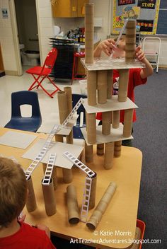 two children are playing with toys in the classroom