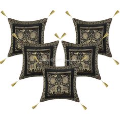 four pillows with decorative designs on them