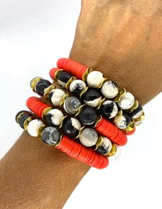 "This listing is for 1 bracelet made with Hot Coral African clay discs, black and white agate beads and gold accents. My hand-beaded bracelets are made with stretch elastic which makes it comfortable and easy to wear. My bracelets are made to fit an average wrist size of 6.5\"-7\". Take a look around my shop for additional colors to add to your stack! The more the better!" Coral Bracelet, Rainbow Bracelet, White Agate, Stackable Bracelets, Black Bracelets, Heishi Beads, Name Bracelet, Gold Letters, Photo Bracelet