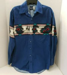 WRANGLER WESTERN MEN'S SHIRT DESCRIPTION:  AMAZING BOLD RODEO COWBOY SOUTHWEST GRAPHIC WRANGLER WESTERN SHIRT PLEASE LOOK AT MEASUREMENTS BELLOW FOR SIZE L BLUE PEARL SNAP BUTTONS COLORS MAIN BRIGHT BLUE with MULTI BLACK, RED, GREEN and MORE for DESIGN TINY FADING 2 POCKETS WITH small BUTTON SNAP FLOP CURVED HEM SLEEVE CUFF HAVE 3 SMALL SNAP BUTTONS PLEASE ASK ALL QUESTIONS BEFORE BIDDING LOOK AT PICTURES - FROM ALL SIDES -  LET US KNOW IF YOU NEED MORE - THE ONES WE HAVE ARE FROM THE ACTUAL SHI Blue Western Shirt With Button Closure, Western Blue Button-up Top, Casual Pre-washed Blue Shirt, Blue Casual Pre-washed Shirt, Western Style Blue Denim Shirt, Blue Denim Western Shirt, Retro Blue Tops For Rodeo, Vintage Blue Tops For Rodeo, Blue Retro Tops For Rodeo