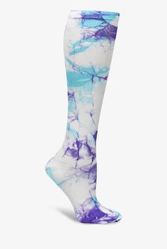 Treat your feet and legs to a little support. The light, gradient compression of Nurse Mates NA0015099 Lilac Aqua Tie Dye Compression Socks is designed to help energize and soothe. Compression is greatest at the ankle, lessens gradually to the non-binding top band. Colorful, long-lasting print. One size fits most. • Nylon-stretch blend • Light compression: 12-14 mmHg • Gradient compression • Controlled pressure from the ankle up • Promotes better blood circulation • Reduces leg fatigue • Knee le Comfortable Blue Training Socks, Compression Knee-high Socks In White, White Compression Knee-high Socks, White Stretch Nylon Socks, Comfortable Fitted Socks For Workout, Lightweight Micro-elastic Sports Socks, Comfortable Fitted Workout Socks, Blue Casual Training Socks, Casual Blue Training Socks