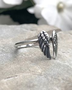 Silver Angel Wings Ring | The Life Divine Adjustable Sterling Silver Ring with Angel Wings Design Angels, messengers of the divine, journey with us and safeguard our travels. They are celestial beings and guardian spirits that act as a guiding influence and an intermediary between heaven and earth. Angel Wings Ring Measures approximately 1/2" H x 1/2 'W Adjusts to any finger size. Handcrafted in Thailand. When feathers appear Angels are near. Angel Wings Ring, Wings Ring, Celestial Beings, Angel Wing Ring, Angel Wings Design, Silver Angel Wings, Wings Design, Earth Angel, The Divine