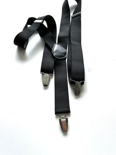 It's a Vintage great looking stylish unisex black elastic suspenders. With silver metal details. With metal clips. Adjustable. Condition: Great vintage condition. Material: Mixed. MEASUREMENTS:  Width: 1,5 inch / 4 cm. Worldwide shipping. Shipping takes to: USA 7-14 days.  EU 4-7 days. Others countries 7-14 days. Fitted Black Belts And Suspenders For Party, Elegant Black Belts And Suspenders With Adjustable Straps, Classic Black Belts And Suspenders For Party, Formal Black Belts With Adjustable Strap, Classic Black Belts And Suspenders With Adjustable Strap, Black Belts And Suspenders With Adjustable Straps, Classic Black Belt With Adjustable Strap, Goth Belt, Accessories Silver