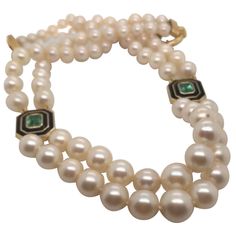 Double strand necklace of Antique 1950’s Estate Japanese Cultured Akoya Pearls, modernized with 3.04 Carats of Emerald Cut Green Brazilian Tourmalines framed by opulent black enamel, set in 18 Karat Yellow Gold. 18.5 inches in length, this beautiful cream-colored Double Strand of Graduated Pearls is divided at the 4 o’clock and 8 o'clock positions by brilliant green tourmalines from the Golcunda mine in Brazil. A two-inch clasp of 14 Karat Yellow Gold in a ring-style manner finishes off the piec Art Deco Pearl, Dramatic Necklace, American Art Deco, Pearl And Diamond Necklace, Pink Tourmaline Ring, Black Onyx Necklace, Double Strand Necklace, Onyx Necklace, Enamel Necklaces