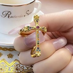 VAIGE Gold Cross Ring Colorful Cross Victorian Vintage 925 Sterling Discover the enchanting elegance of the VAIGE Gold Cross Ring, a masterpiece that beautifully combines vintage charm with modern sophistication. This exquisite ring features: Stunning Craftsmanship: Weighing 4.41g, this ring is meticulously crafted with high-quality materials, ensuring a luxurious feel and lasting durability. Vibrant Main Stone: Adorned with a captivating Zircon, the ring sparkles brilliantly, drawing attention Elegant Multicolor Promise Ring, Multicolor Open Ring Crystal Ring Gift, Multicolor Open Crystal Ring As Gift, Elegant Multicolor Open Crystal Ring, Multicolor Open Ring For Promise, Multicolor Open Crystal Ring, Vintage Multicolor Rings For Gifting, Elegant Multicolor Open Ring, Vintage Multicolor Rings For Gifts