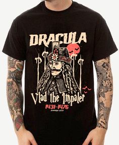 Unleash your inner vampire with the 'Dracula' Unisex Tee! Featuring the iconic figure of Dracula Vlad the Impaler, this spooky t-shirt is perfect for all your Halloween festivities. Embrace your Halloween spirit and stand out from the crowd with this unique and playful tee. (No garlic required. Fangs not included.) . Dracula Vlad the Impaler. 100% combed ringspun cotton· Light fabric· Premium fit· Runs bigger than usual· Original design Care Instructions: Machine wash cold. Do not bleach. Tumble Black Halloween Concert T-shirt, Horror Graphic Print Top For Alternative Fashion, Alternative Style Top For Halloween Costume Party, Halloween Band Logo T-shirt For Fans, Halloween Band Logo T-shirt Crew Neck, Halloween Band Logo T-shirt, Halloween Band Merch Tops With Band Logo, Halloween Band Merch Top With Band Logo, Band Logo Merch Tops For Halloween