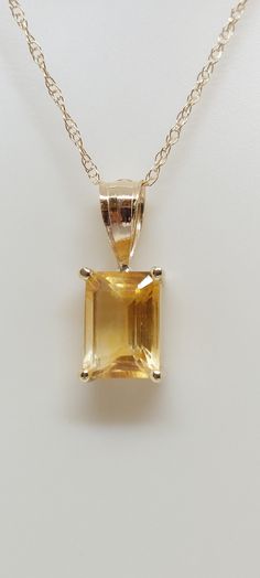 "CITRINE 14k Yellow Gold Pendant / Necklace. Natural stone. 18\" gold Chain necklace. Rectangle Gemstone Jewelry. Yellow Citrine. November Birthday Stone. Product Info: - Stone: Rectangle Yellow Citrine. - Color: Yellow. - Pendant Measures: 12mm x 4mm. - Stone Measures: 5x4mm - Stone Carat: 0.85 - Metal: 14k Yellow Gold. - Chain Length: 18 inches Rope Chain. - Made in USA. - Nice Gift Box Included." Luxury Citrine Faceted Necklace, Luxury Polished Citrine Necklace, Luxury Citrine Necklace For Formal Occasions, Yellow Stone Necklace, Yellow Gold Necklace With Rectangular Stone For Anniversary, Rectangular Gemstone Necklace In Yellow Gold, Yellow Gold Rectangular Gemstone Necklace, Rectangular Yellow Gold Gemstone Necklace, Yellow Gold Rectangular Birthstone Jewelry