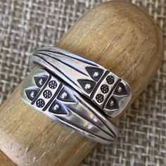 Handmade Sterling Silver Spiraling Men or Women Ring, Ethnic Tribal Geometric engraving Wrap Band Ring, Unisex Adjustable, Can be used as Thumb ring ❋Size: Adjustable, Please choose Men size or Women sizes option ❋Men size: Adjustable to US sizes 9-14 Women Size: Adjustable to US sizes 6-11 ❋Width: 12mm Metal Purity: 95% Silver (Purer than 925 Sterling Silver) To browse some more of our Silver Jewelry collection you can click on the following links: https://www.etsy.com/shop/SilverShapes Earring Unique Adjustable Nickel Free Engraved Ring, Traditional Adjustable Engraved Ring, Traditional Adjustable Engraved Etched Ring, Adjustable Traditional Engraved Etched Ring, Vintage Adjustable Rings With Unique Design, Adjustable Bohemian Antique Silver Ring, Adjustable Bohemian Stackable Rings, Traditional Adjustable Rings With Oxidized Finish, Artisan Adjustable Engraved Silver Ring