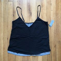 Simple Camisole That Has A Floaty Double Layer Design, Fully Adjustable Slim Straps, And A V-Neckline. Swing Cut With A Regular Fit, Last Photo Is Just To Reference Fit (Not Exact But Very Similar). Size: Small Color: Black, Gray Layer Underneath Chest: 17 1/4” Body Length: 24 1/4” Armhole Length: 8” Neck Opening: 9” Black V-neck Tank Top For Layering, Black Casual Camisole For Layering, Black Lace Cami Top, Striped Cami Tops, Silk Camisole Top, Black Lace Cami, Babydoll Tank Top, Layered Tank, Layered Tank Top