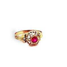 Such an eyecatch! This Victorian era ring is made in lush 18K gold and set with a synthetic red ruby in the center that shimmers in the light. Surrounding that mesmerizing stone is a halo of white diamonds that are pave set and total to .05ctTW. The head of the ring measures 9.41mm long, 9.71mm wide and sits 5.11mm tall. The ring is a size 7 and weighs 1.3DWT. C9168BYVPM --Please reference our policy for more details-- For International orders, please provide a phone number for shipping purposes Heirloom Yellow Gold Ruby Signet Ring, Heirloom Ruby Signet Ring In Yellow Gold, Antique Red 14k Gold Signet Ring, Antique Red Signet Ring In 14k Gold, Heirloom Ruby Signet Ring With Hallmark, Formal Ruby Signet Ring, Red Cluster Ring With Rose Cut Diamonds, Heirloom Red Gold Signet Ring, Gold Ruby Signet Ring For Formal Occasions