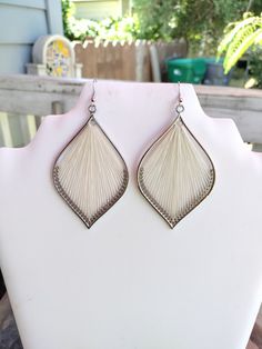 White and Silver Leaf Thread Earrings. Very nice will make a great gift or wear them yourself. Perfect for the Fall Weather and the beautiful Frozen Autumn Leafs. They are 2 1/2 inch long and 1 inch wide. If you have any Questions please ask. Thanks for looking. White Bohemian Pierced Jewelry, White Bohemian Teardrop Earrings, White Bohemian Teardrop Earrings For Pierced Ears, Nickel-free White Bohemian Chandelier Earrings, Adjustable Nickel-free White Teardrop Earrings, White Bohemian Nickel-free Chandelier Earrings, Bohemian White Nickel-free Chandelier Earrings, White Bohemian Pierced Earrings, Nickel Free White Jewelry For Festival